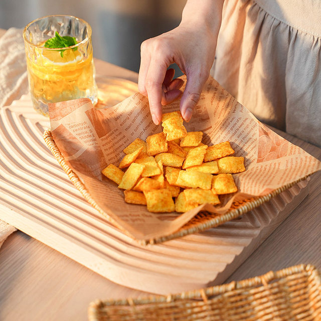 It is a plastic Japanese square snack plate with dessert melon seeds
