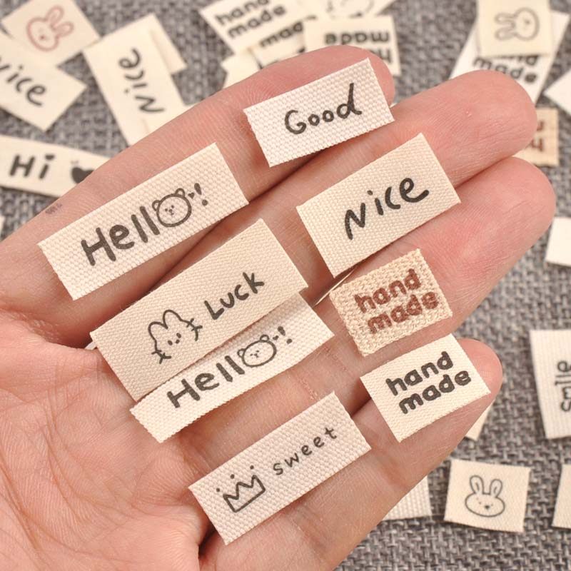 米色标签衣服服装领标手工制作折边布标DIY布贴服饰标签100个,淘宝优惠券,粉丝福利购,淘宝优惠卷