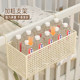 Metal bottle diapers beside the crib without punching