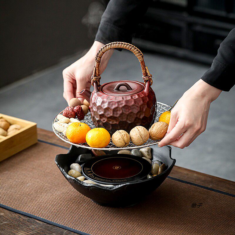 Ceramic teapot for making tea around the stove