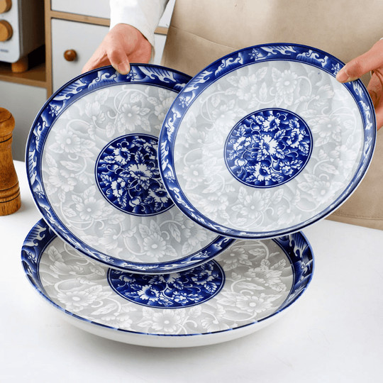 Plato de porcelana azul y blanco plato plato de cerámica para el hogar plato de arroz de color vidriado 2025 nuevo hotel vajilla plato grande comercial
