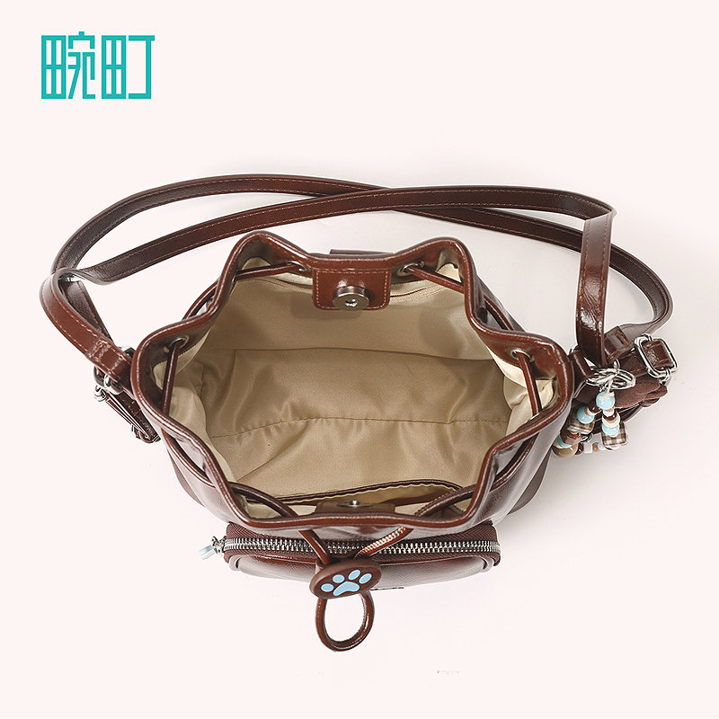 畹町焦糖可露丽油蜡皮包女秋冬复古蓝棕单双肩通勤女包抽绳水桶包,淘宝优惠券,粉丝福利购,淘宝优惠卷