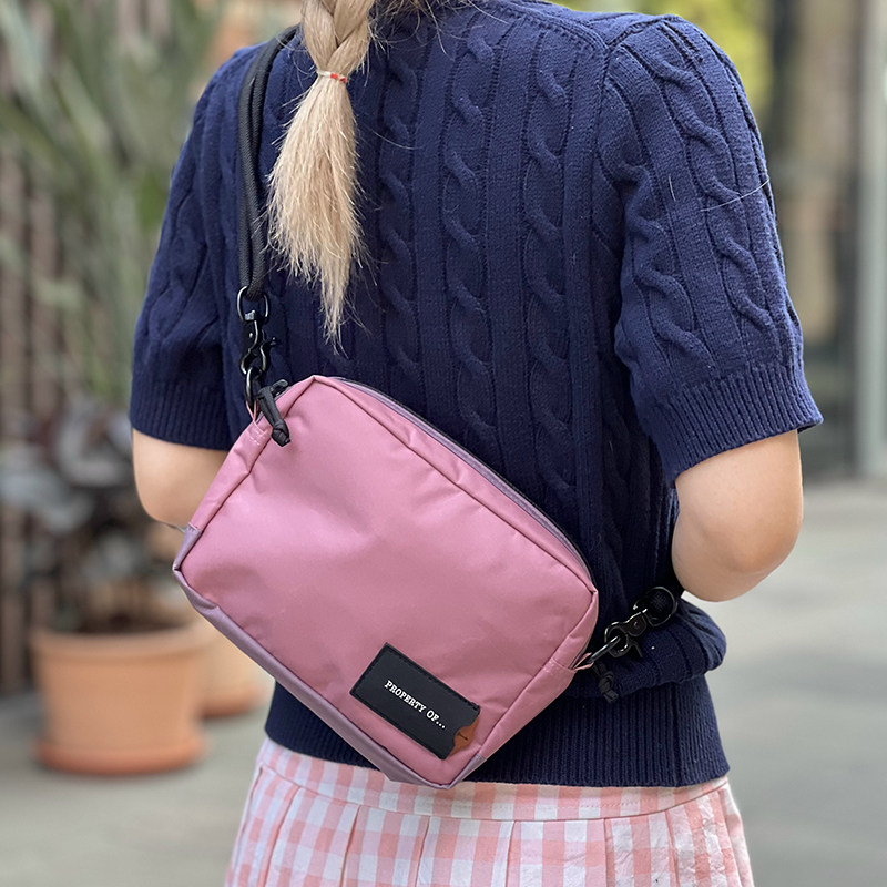 Propertyofcasual portable crossbody bag
