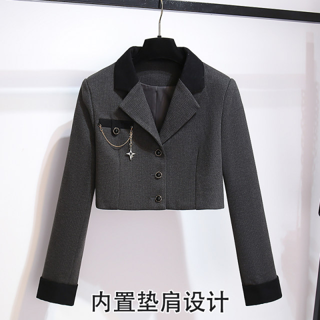 Short suit jacket with pleated skirt