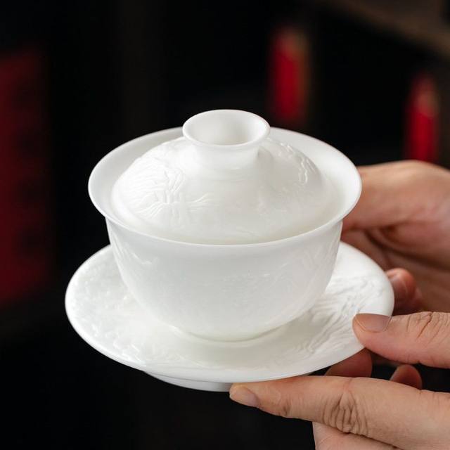 Thousands of mountains and rivers embossed ice jade porcelain three-piece covered bowl teacup household tea three-piece set with lid 2026 new style