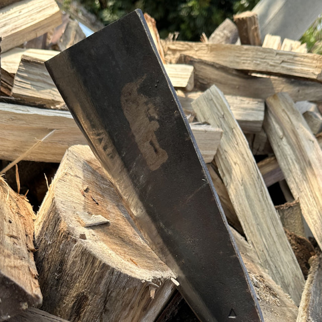 Old-fashioned agricultural wood cutting knife for cutting bamboo branches outdoors