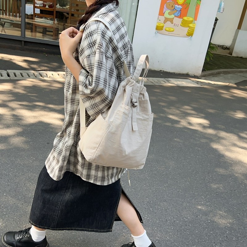 新款2024日系休闲双肩包束口抽绳书包户外运动登山大容量旅行包,淘宝优惠券,粉丝福利购,淘宝优惠卷