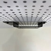 Perforated board computer screen stand saves space