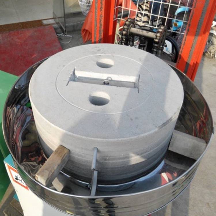 New type of wheat and cereal flour mill electric stone mill. Grain and cereal flour stone mill.