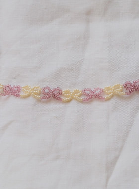 甜美粉白撞色蝴蝶结串珠手链精致