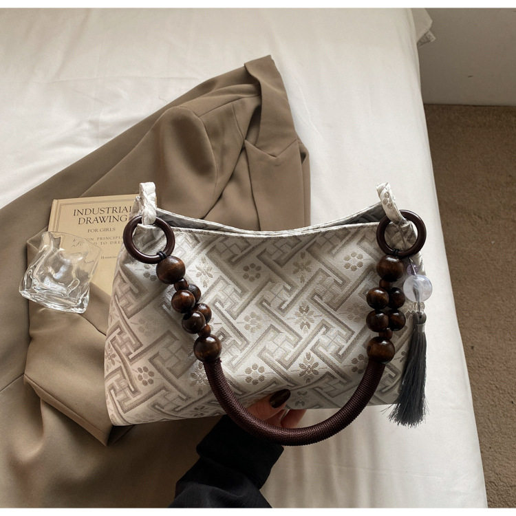 广西壮锦包包新中式腋下包包女2025新款夏天简约布包单肩手提包,淘宝优惠券,粉丝福利购,淘宝优惠卷