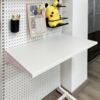 Perforated board bookshelf floating tabletop