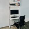 Perforated board bookshelf floating tabletop