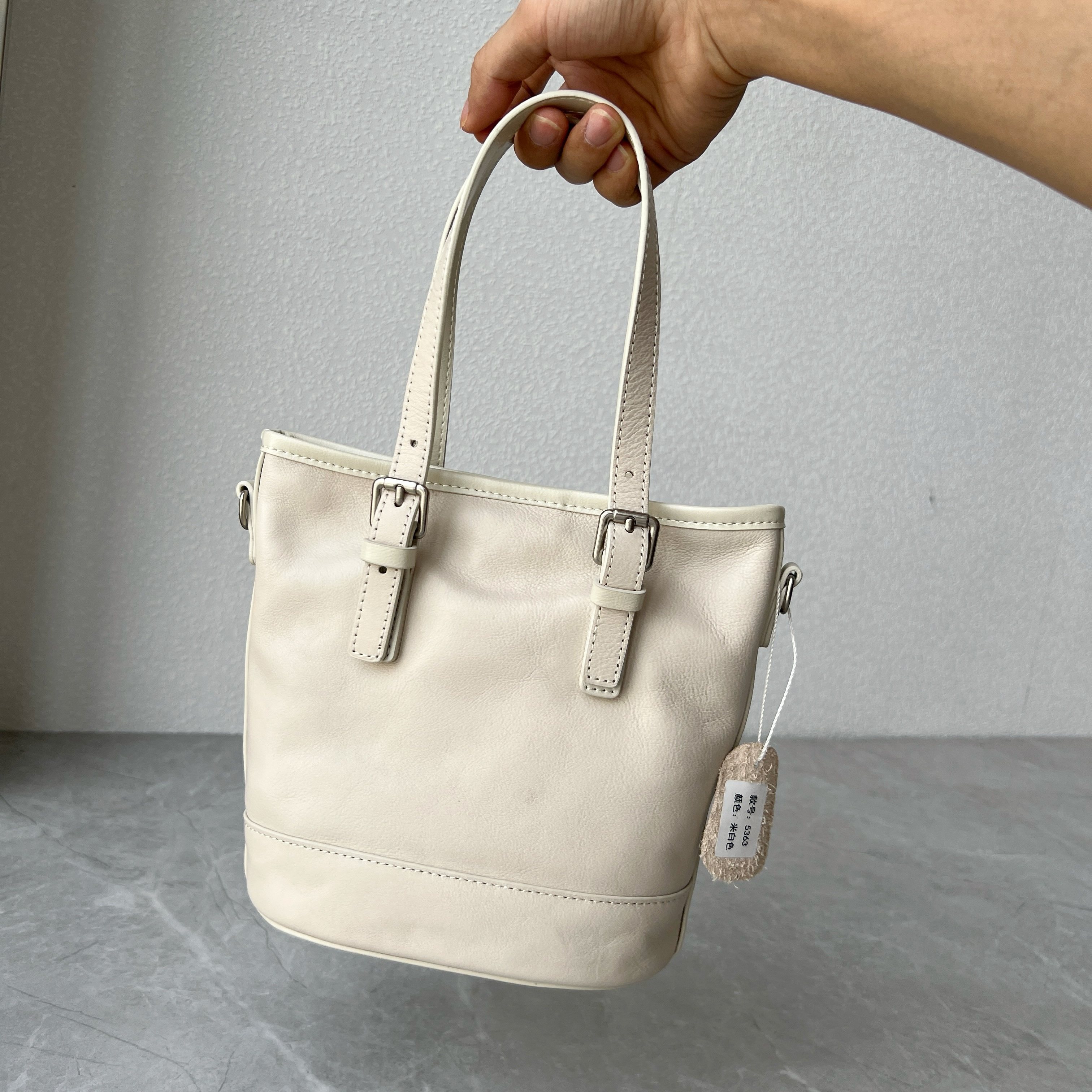 头层植鞣牛皮小众设计水桶包女士气质百搭手提包真皮时尚斜跨包包,淘宝优惠券,粉丝福利购,淘宝优惠卷