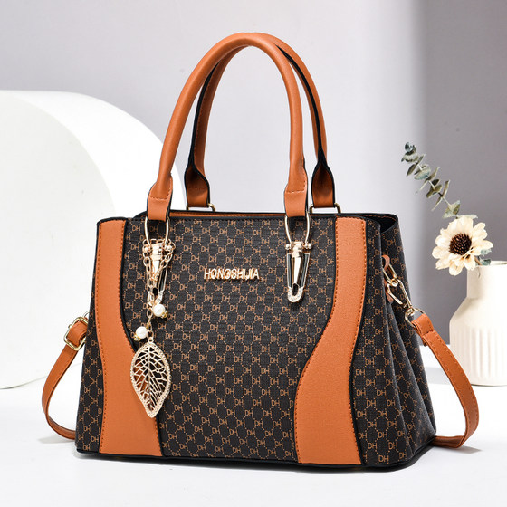 Textured and elegant women's hand-held crossbody bag 2026 new large-capacity middle-aged mother bag commuting versatile tote bag