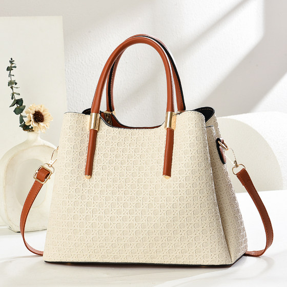 Seaside vacation woven straw bag for women 2026 new high-end contrasting color portable bucket bag single shoulder crossbody bag