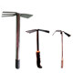Two busy rakes and hoe agricultural and gardening tools for growing vegetables, weeding, harvesting vegetables, plowing soil, loosening soil and digging holes