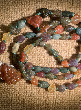 高品新疆玻璃透鱼子项连，对孔尺寸1.0，珠子油润，色高雅