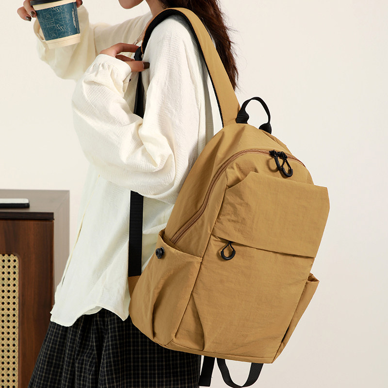 2025新款户外运动双肩包女书包男女牛津布纯色轻便多功能通勤背包,淘宝优惠券,粉丝福利购,淘宝优惠卷