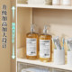 Narrow storage rack behind bathroom door