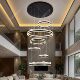Large hollow staggered chandelier in the duplex building of the villa