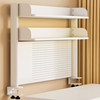 Multi-layer perforated board bookshelf on home computer desk