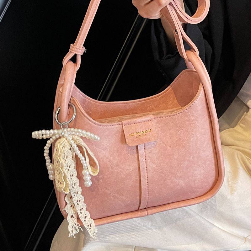 小众设计包包女2025春夏新款韩版大容量单肩腋下包百搭斜挎水桶包,淘宝优惠券,粉丝福利购,淘宝优惠卷