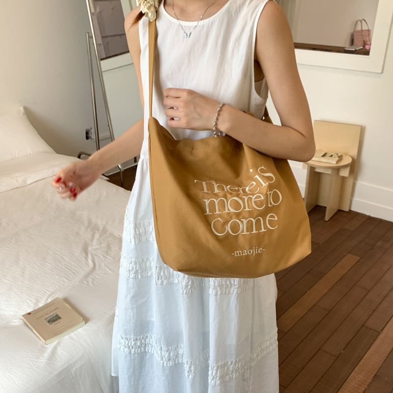 大容量单肩斜挎包女新款百搭通勤购物袋帆布包夏韩版慵懒风托特包 - 图1