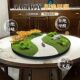 Large round table with flowers in the middle of high-end hotel dining table