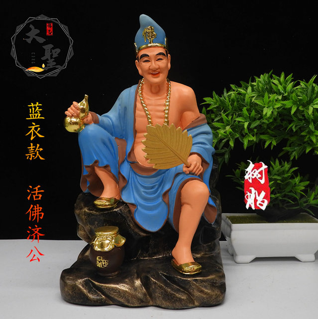 The resin statue of Jigong is enshrined in white marble