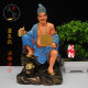 The resin statue of Jigong is enshrined in white marble