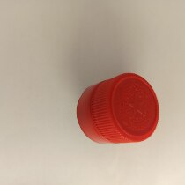 Cake decorated wine bottle cap floating with inedible a contact customer service note