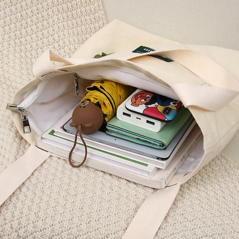 黑色女单肩斜挎手提装书袋a4帆布包 萨凯莉女士包袋