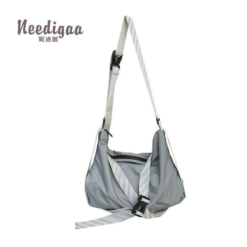 大容量文艺风女尼龙布运动男单肩包 妮迪珈女士包袋