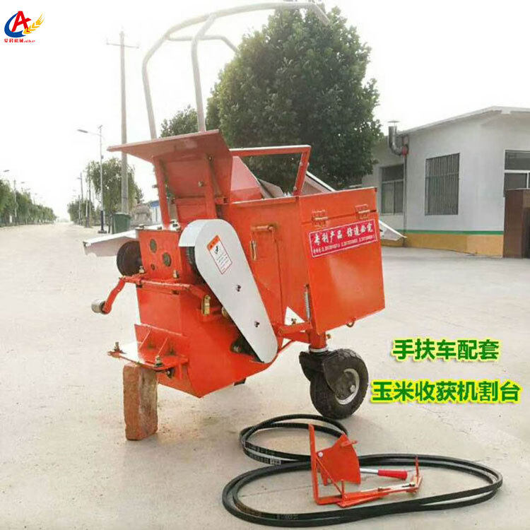 Household mini-tiller with corn harvester Household hand-held trolley with single-row straw crushing and returning corn harvester