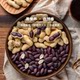 Independent small package of shelled black skinned cooked peanuts, nuts and roasted seeds and nuts