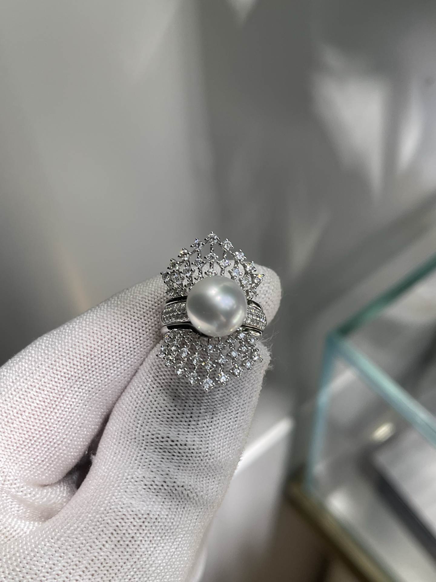 A two-wear ring that can be worn daily or for flamboyance. 10.64mm Australian white set with 18k natural diamonds. Dazzling.