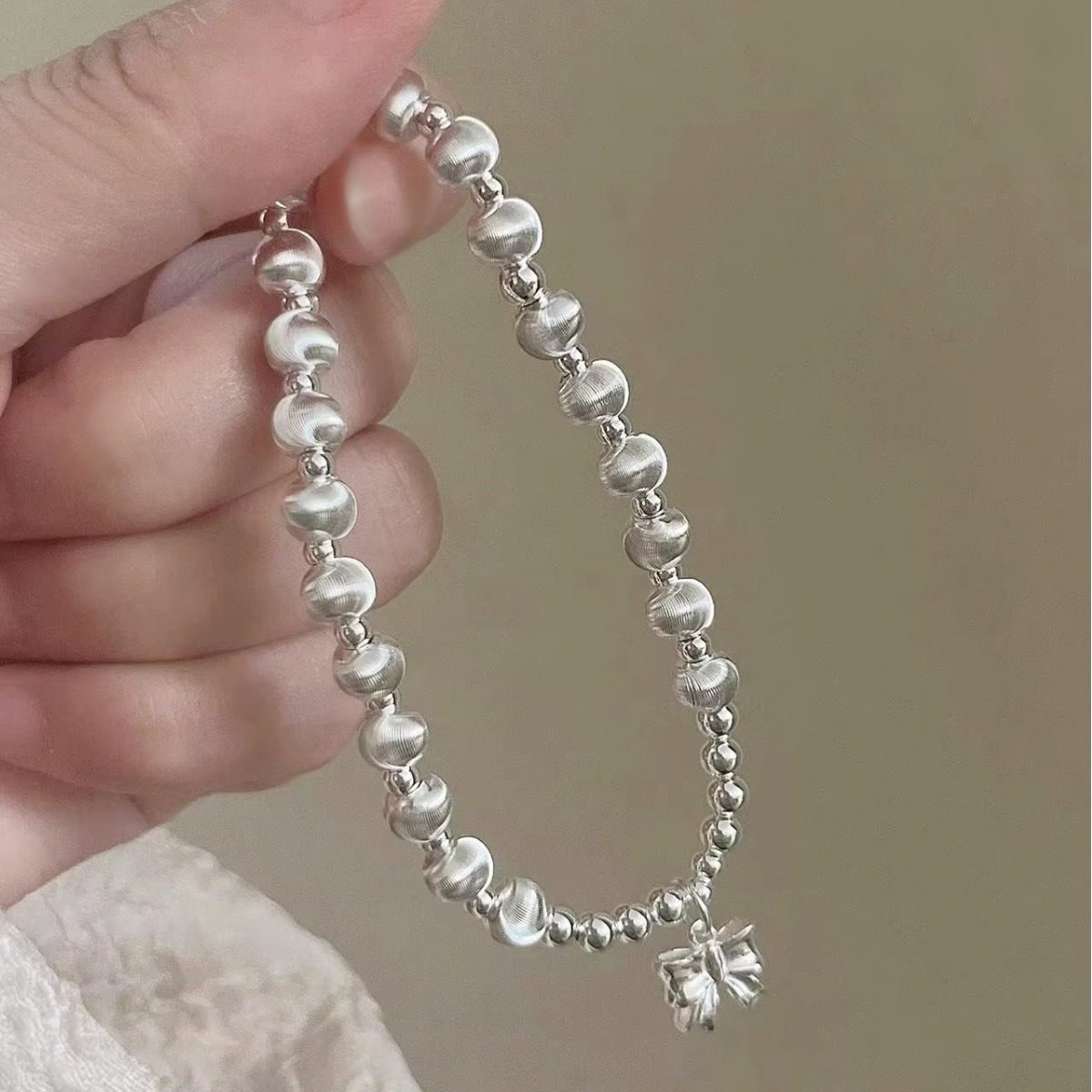 猫眼手链s925纯银蝴蝶结银珠手串女弹力绳转运珠手工简约小众手饰,淘宝优惠券,粉丝福利购,淘宝优惠卷