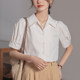 ເສື້ອຢືດສີຂາວແຂນເສື້ອ, ແບບ retro ແລະ versatile ສໍາລັບການເດີນທາງ