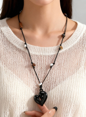 A heart-shaped pendant necklace with a feminine design sense