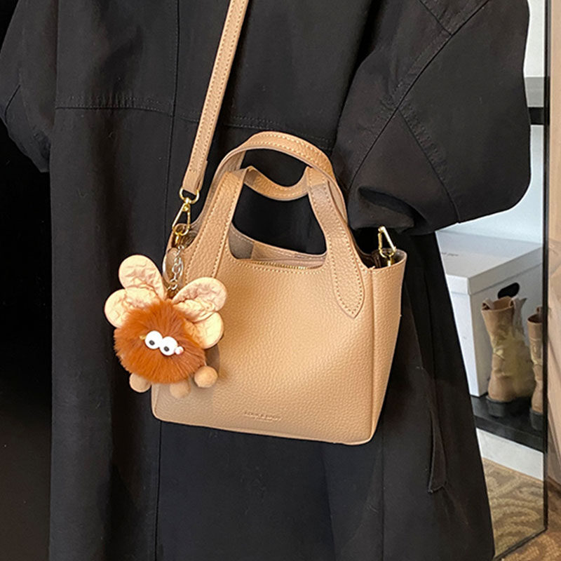 韩国ins潮流时尚水桶包女2025冬季简约百搭单肩包高级感休闲女包,淘宝优惠券,粉丝福利购,淘宝优惠卷