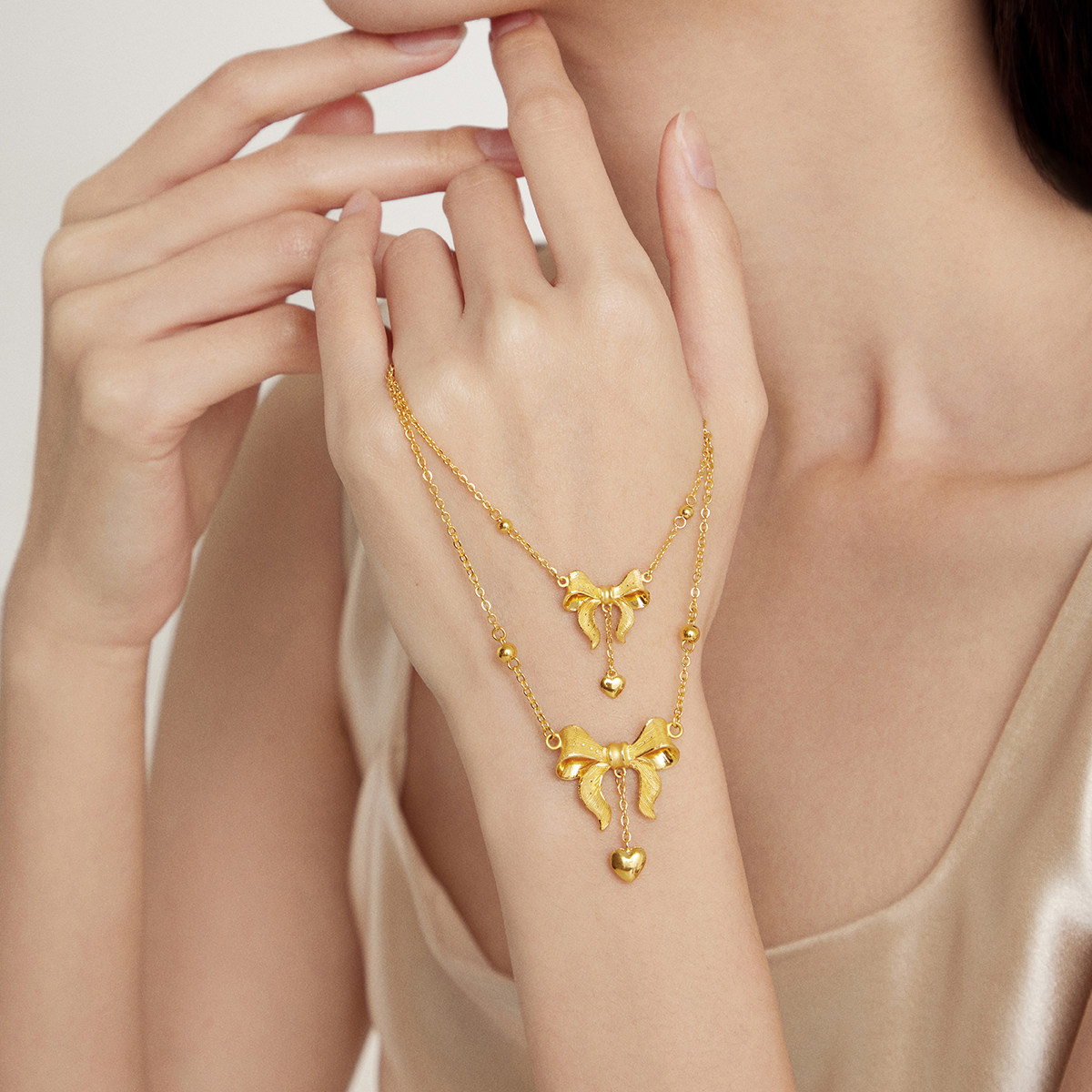 周大福在逃公主爱心蝴蝶结黄金项链大版计价F193290情人节
