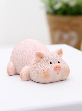 The cute little pigfish has a car-loaded tabletop office pig
