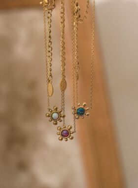 英国George Melis钛钢高保色轻奢小巧太阳花 火彩仿欧泊石耳钉