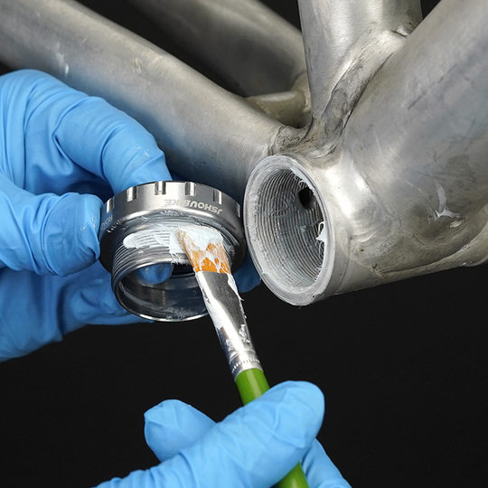 Ceramic interface grease removes noise and water resistance for bicycle assembly