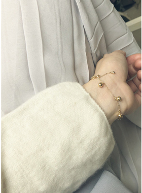 带定位珠自由滑动流苏手链包金