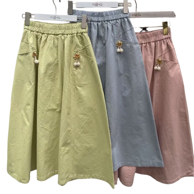 Japanese college style solid color elastic waist A-line pocket skirt for women. High-waisted, slim, sweet, simple and versatile skirt