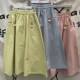 Japanese college style solid color elastic waist A-line pocket skirt for women. High-waisted, slim, sweet, simple and versatile skirt