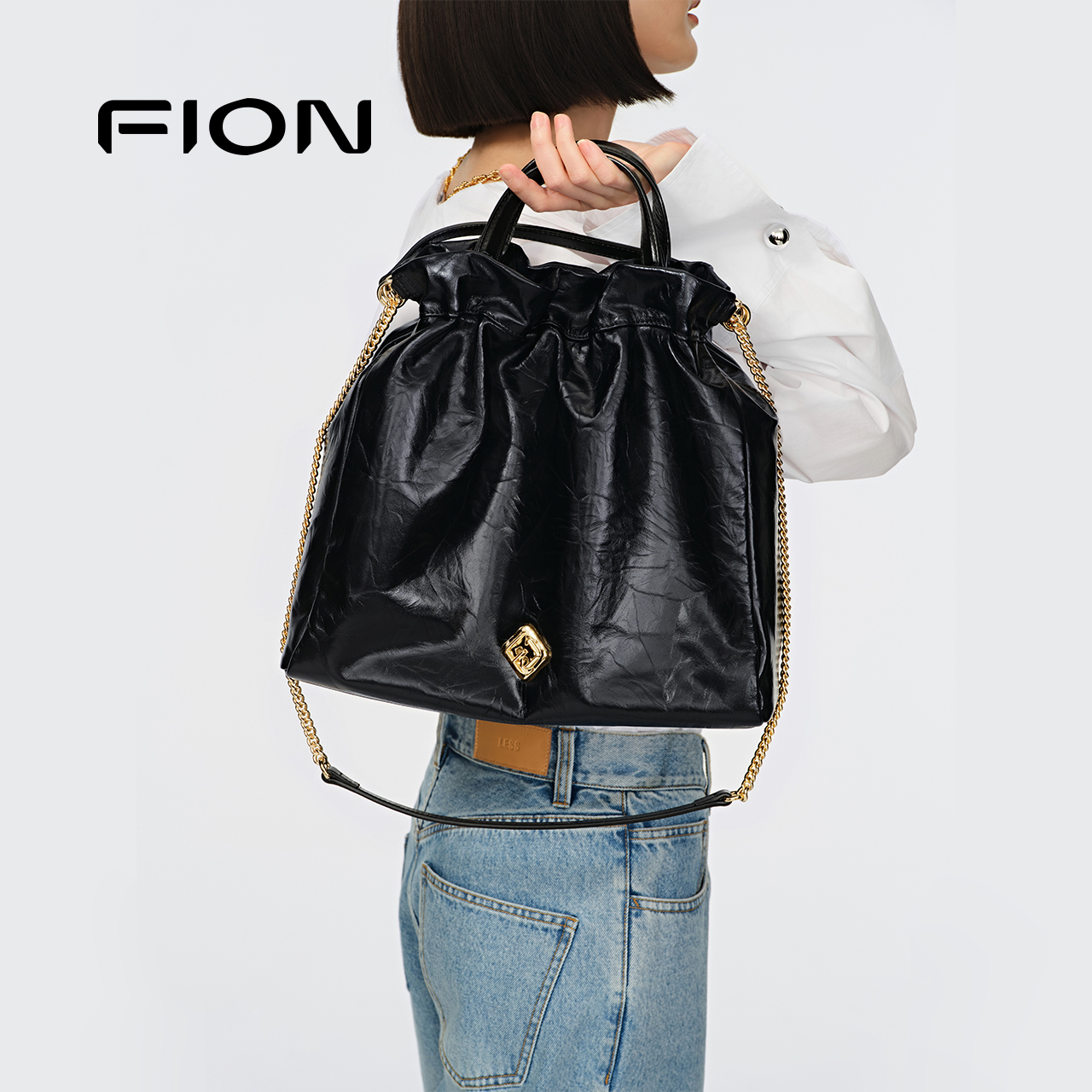 Fion/菲安妮流浪包新款真皮水桶包通勤单肩斜挎包垃圾袋包包女