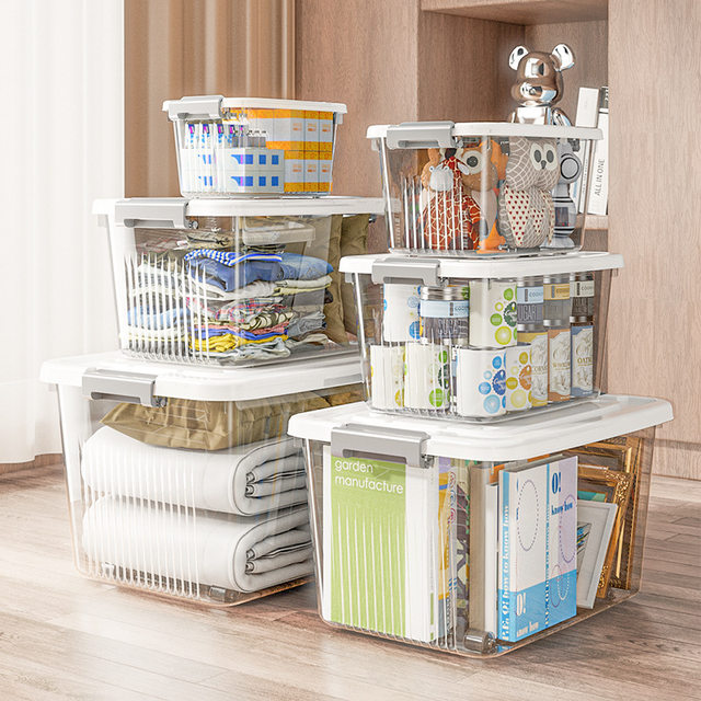 Transparent storage box with plastic clothes and toys
